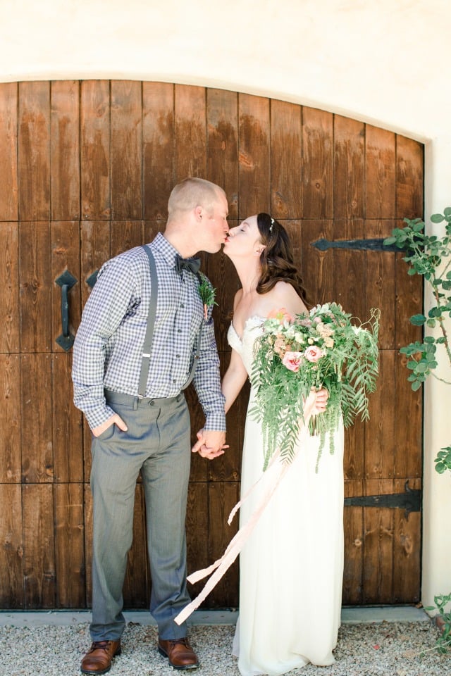groom in grey seersucker and suspenders and bride in Sarah Seven dress