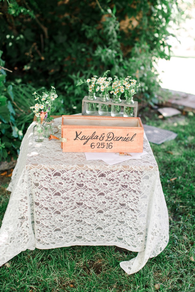 Kayla and Daniels wedding guest book on a lace table