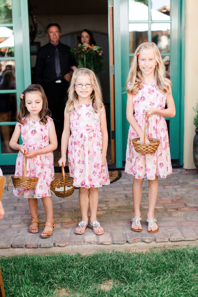 Flower girls with baskets at outdoor wedding ceremony
