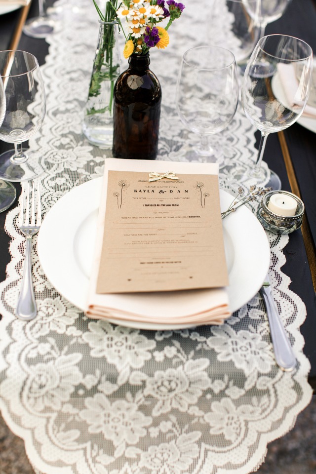 lace table runner and brown paper thank you note at your place setting