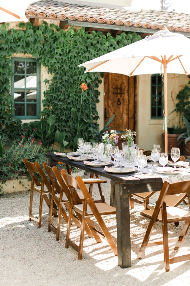 Outdoor dining table set for a celebration in a garden setting