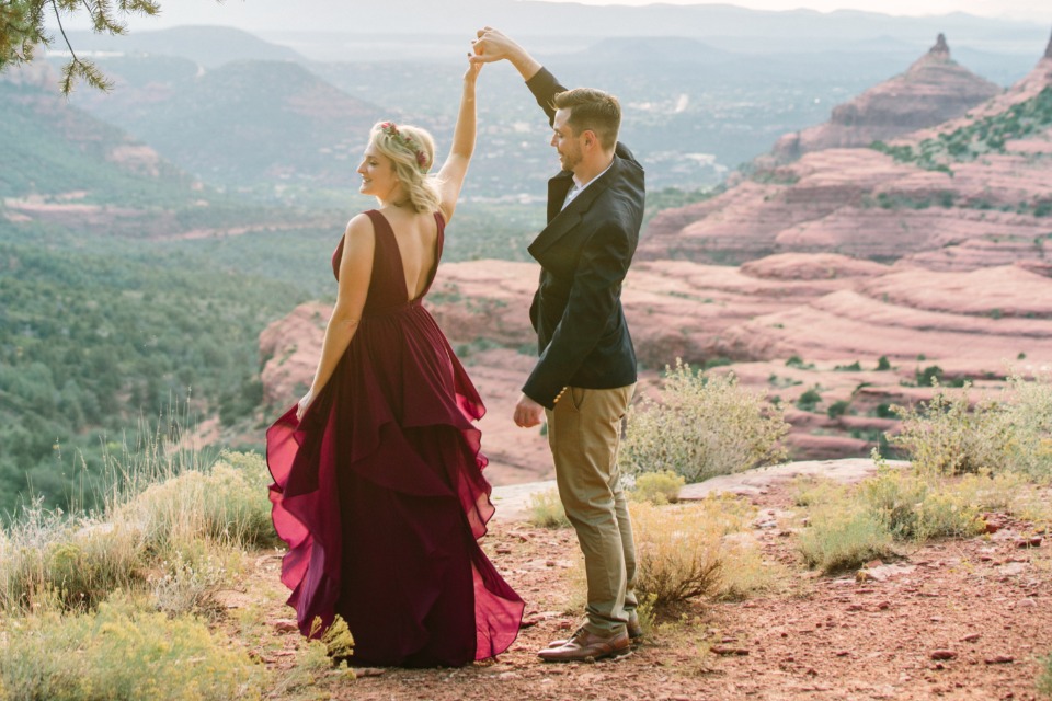 Romantic couple dancing in Sedona mountains landscape