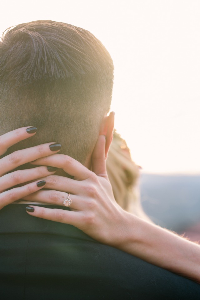 Romantic embrace shows off a beautiful engagement ring