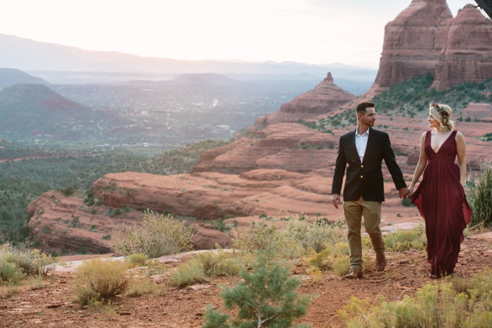 Couple holding hands, scenic Sedona Arizona landscape
