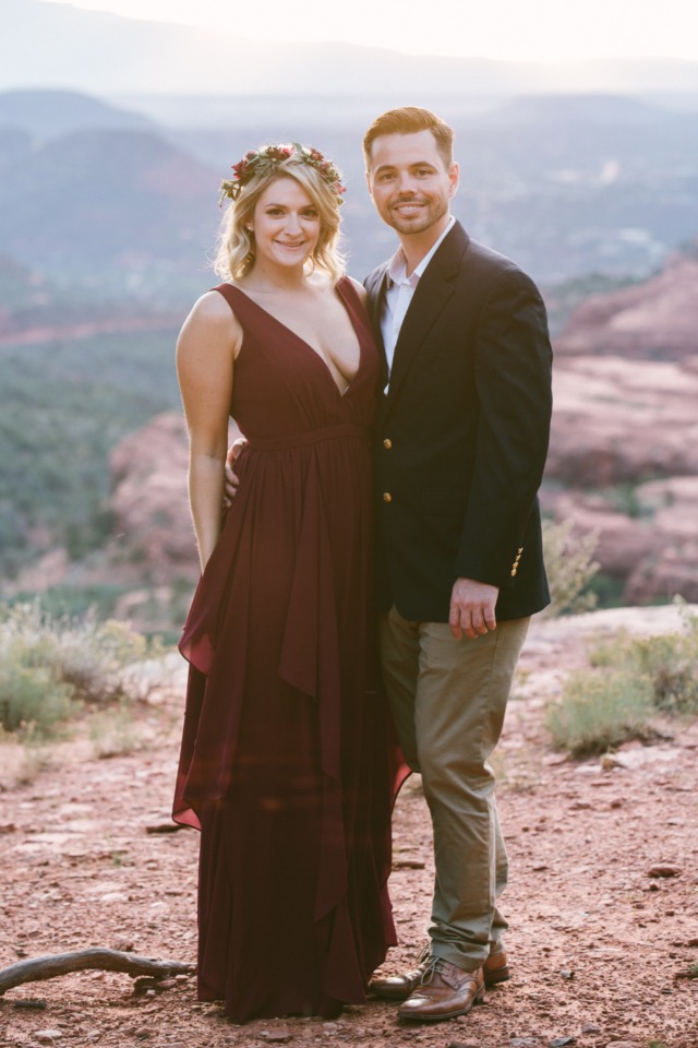 Smiling couple burgundy dress mountain wedding photo
