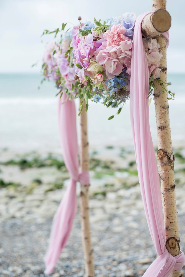 pink and floral wedding arch