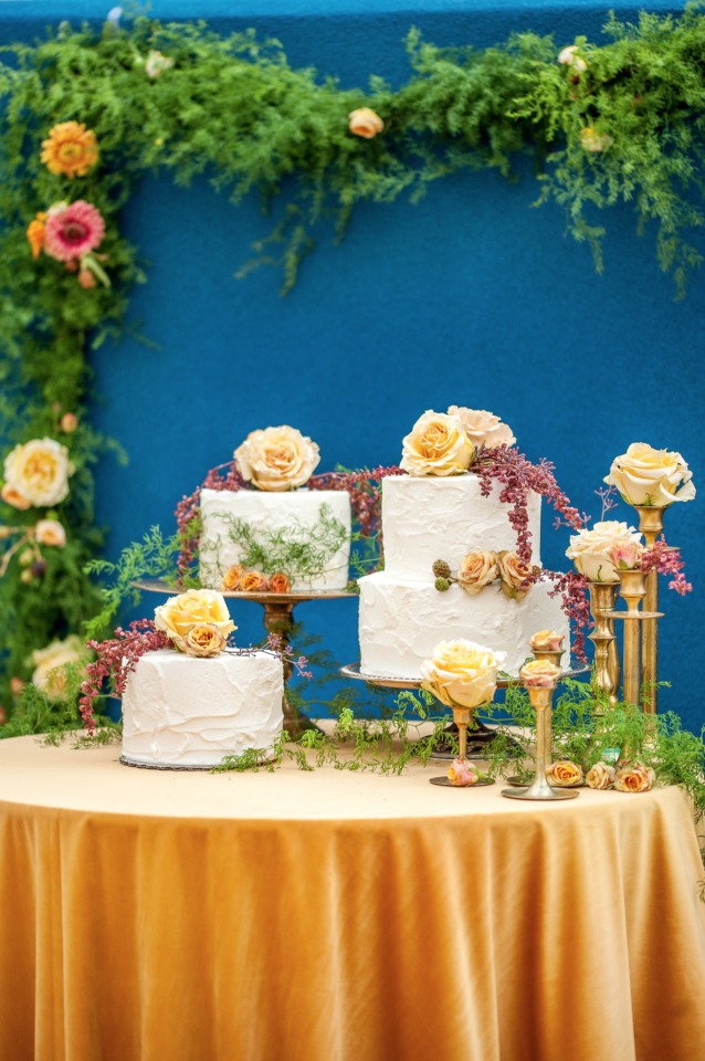 multi level cake table in gold and royal blue