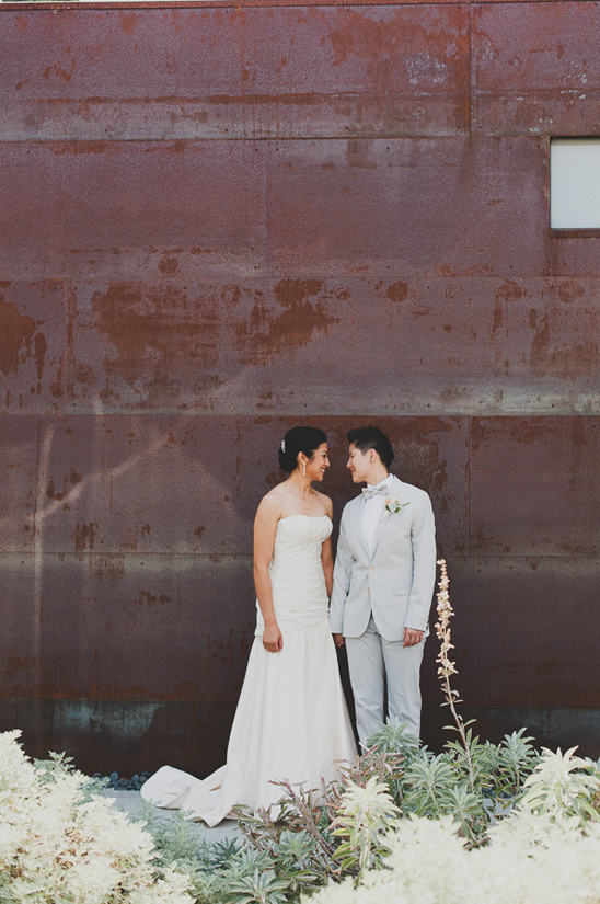 Happy lesbian couple posing for wedding photo