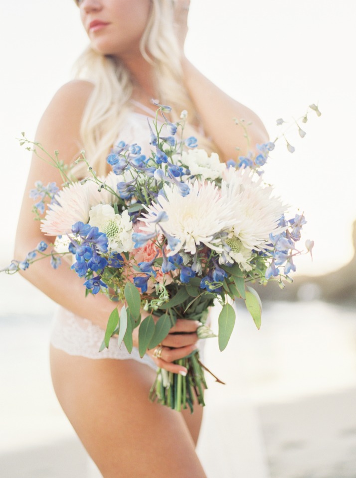 Bride holding a lovely blue and white bridal bouquet