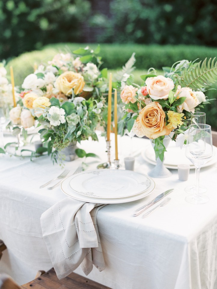 Elegant table setting with floral centerpieces and candles