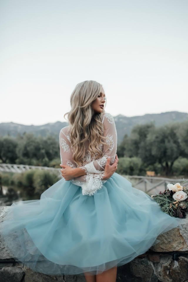 Woman in light blue tulle skirt and lace top