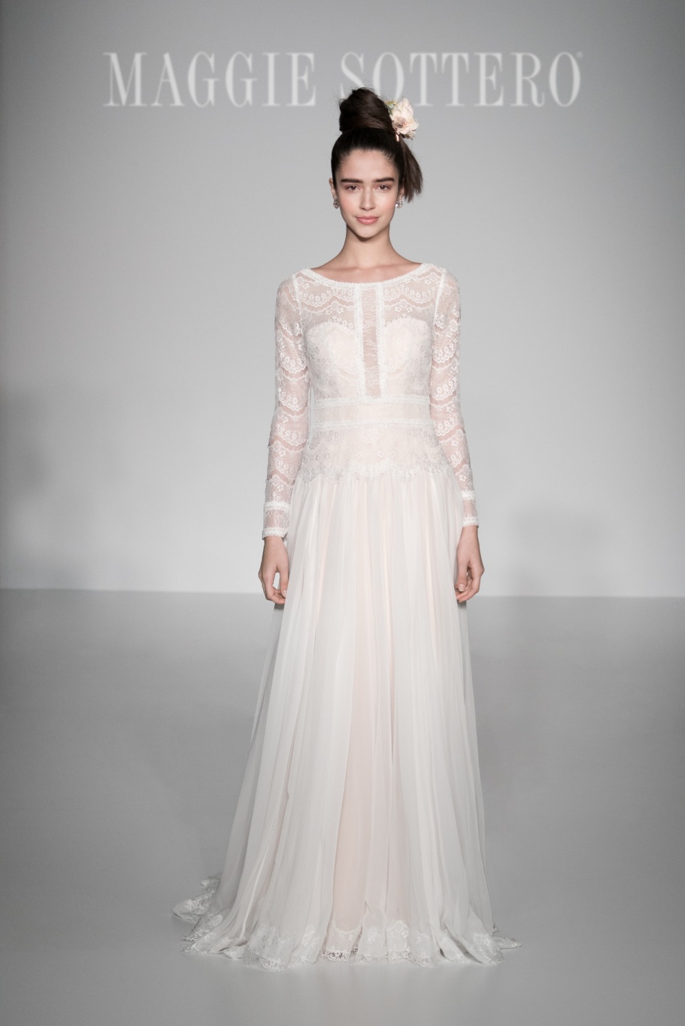 Maggie Sottero lace sleeved wedding gown on runway