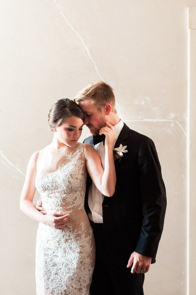 Elegant bride and groom embrace, wedding day portrait