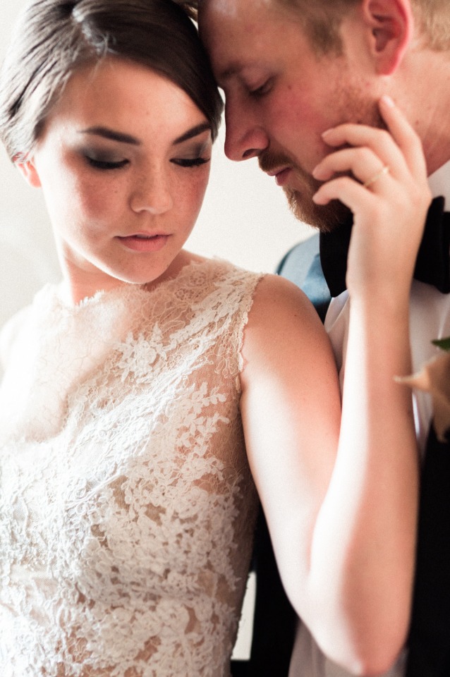 Bride and groom share tender moment, wedding day bliss