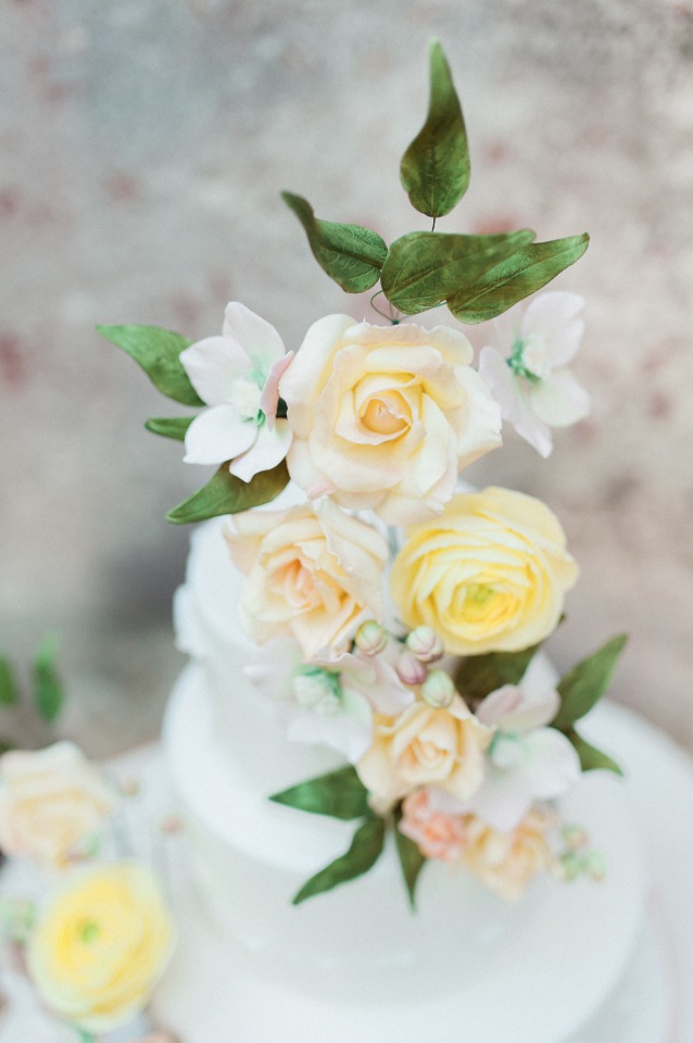 soft yellow and peach flower topped cake
