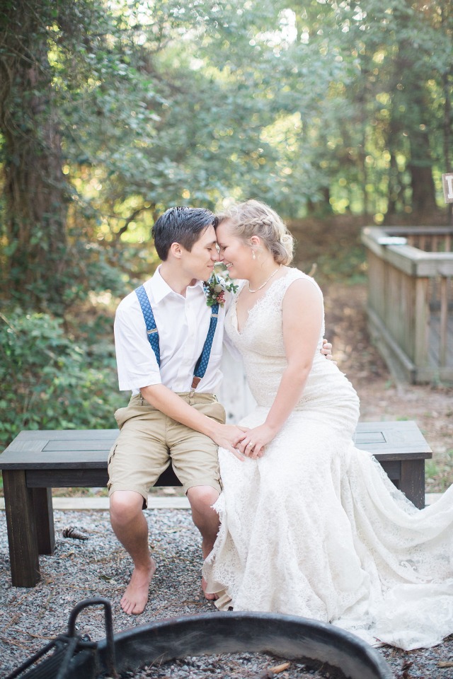 Bride and groom share a happy moment at their outdoor wedding