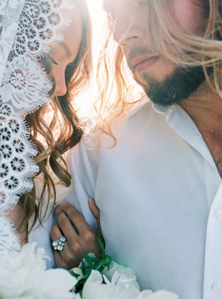 Romantic wedding moment of bride and groom embracing