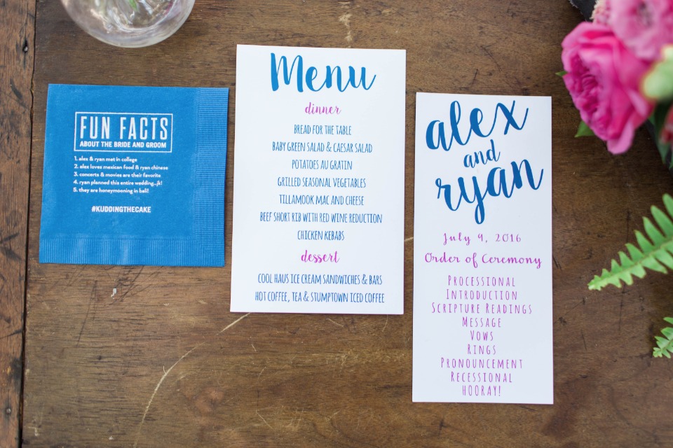 blue and pink menu cocktail napkin and program