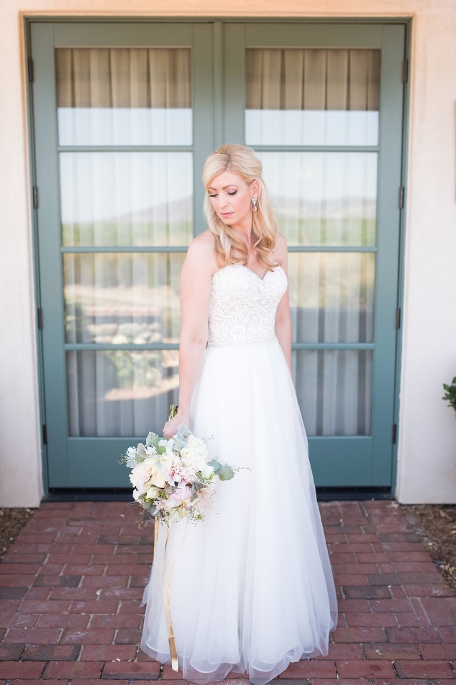 the blushing bride in her Madison James dress