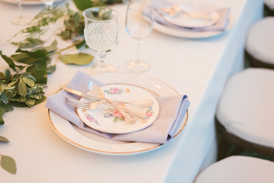 Elegant table setting with floral plate and silverware