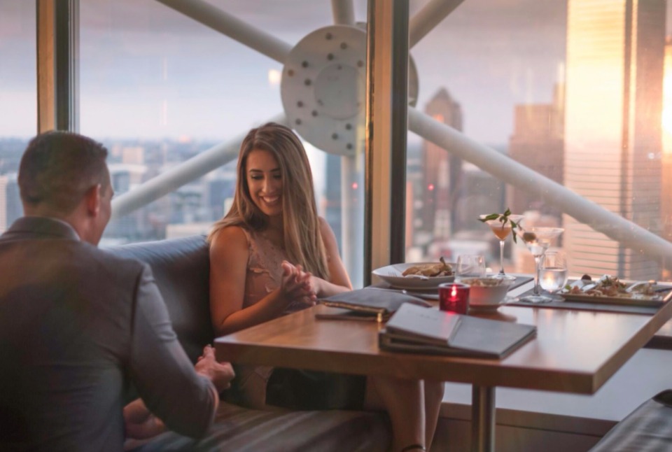 Romantic city-view dinner date at a rooftop restaurant