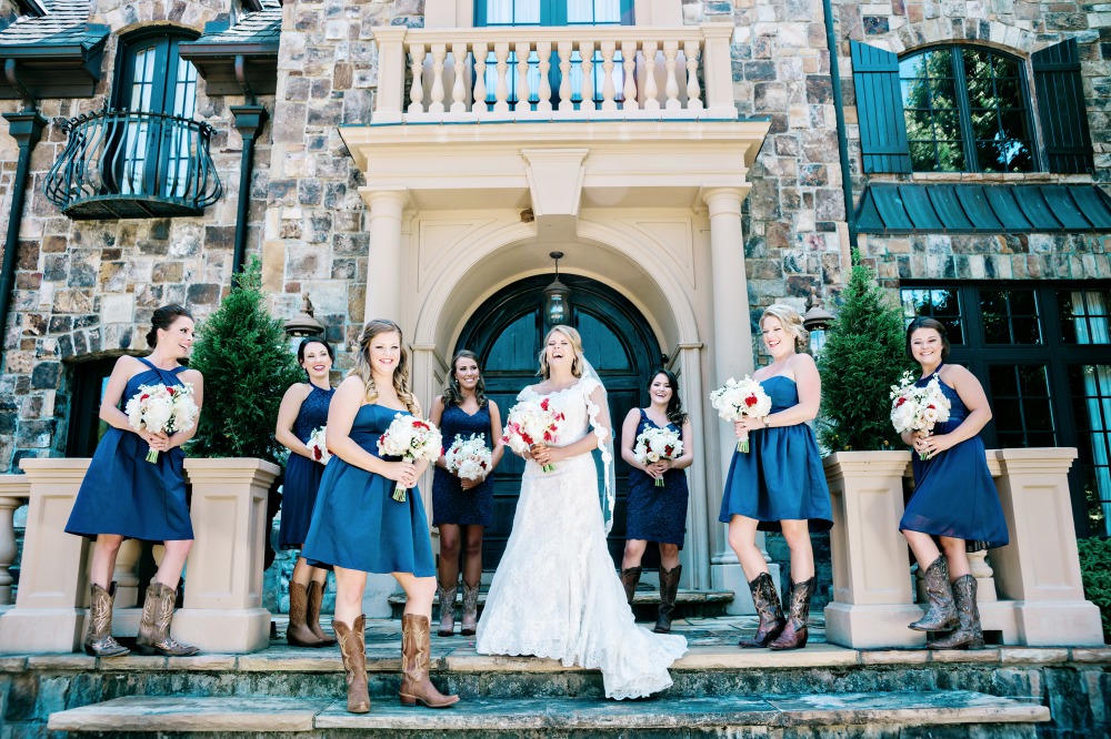 Bridesmaids in navy and cowgirl boots