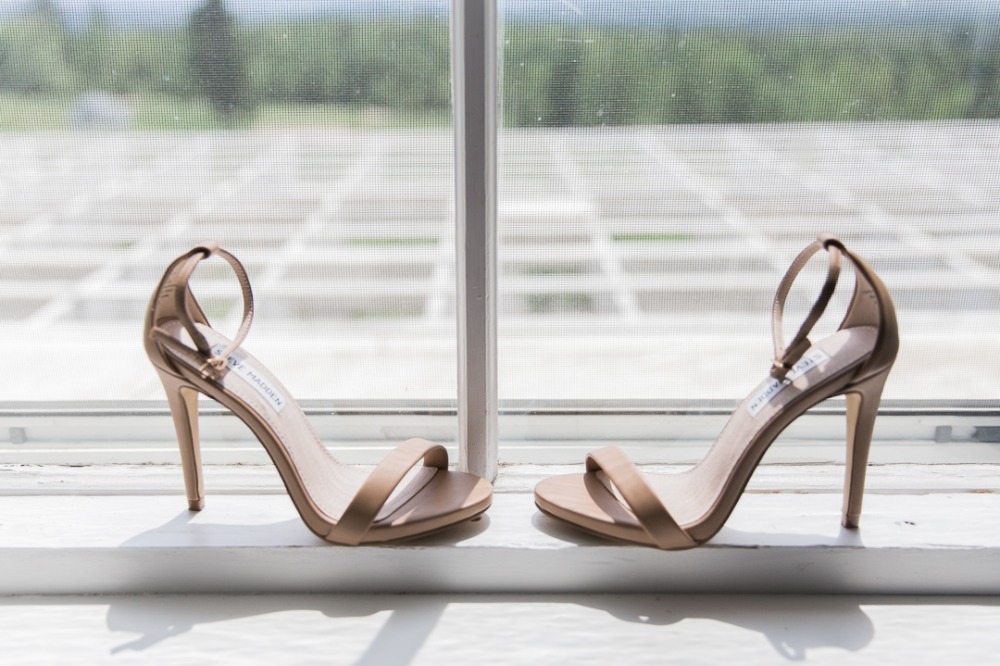 Elegant Steve Madden bridal heels on a window sill