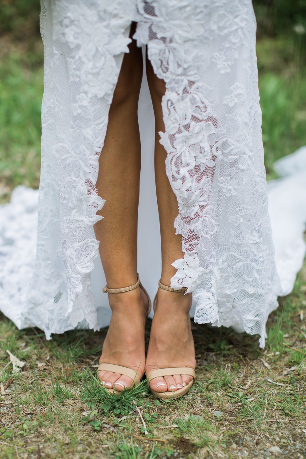 Bride in lace dress and strappy nude high heel sandals