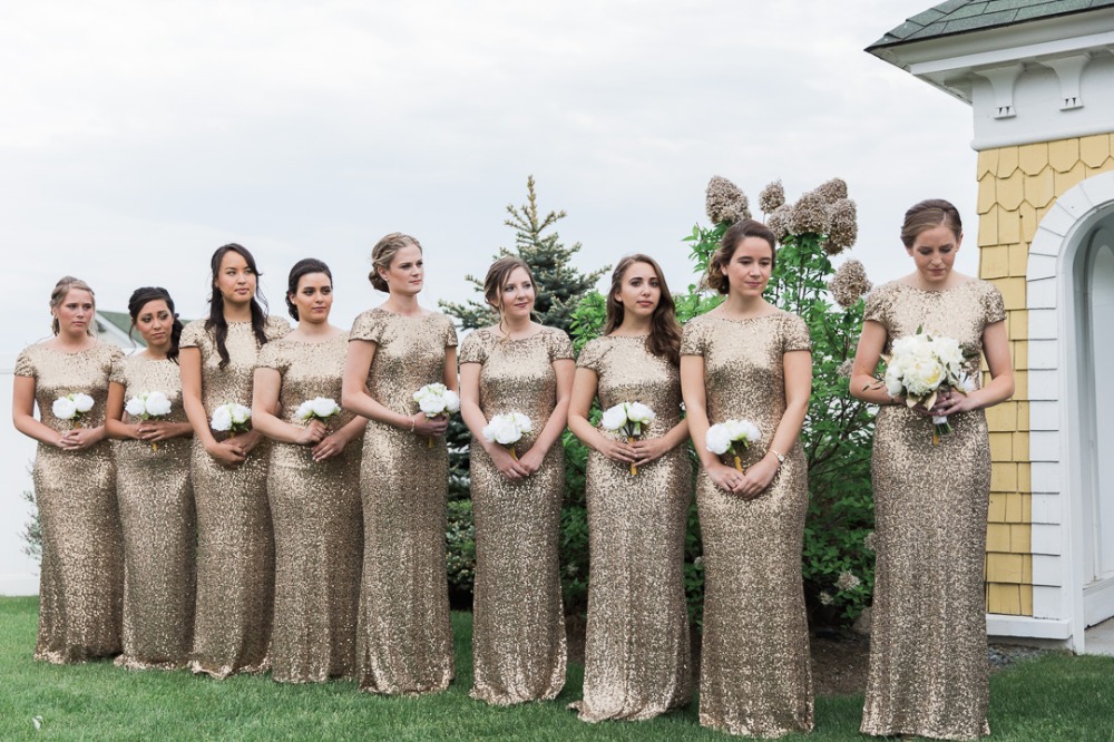 Bridesmaids in gold sequin dresses at wedding venue