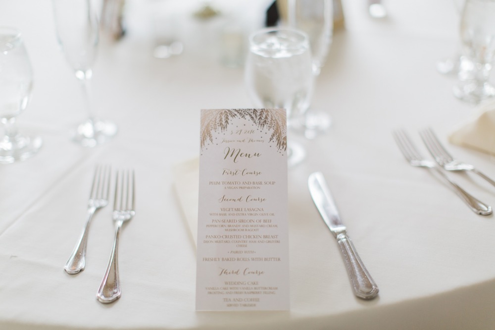 Elegant wedding table setting with menu and silverware