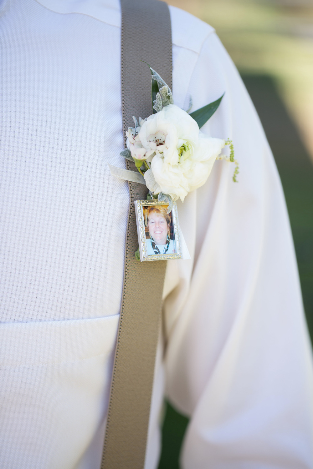 white wedding boutonniere with photo charm