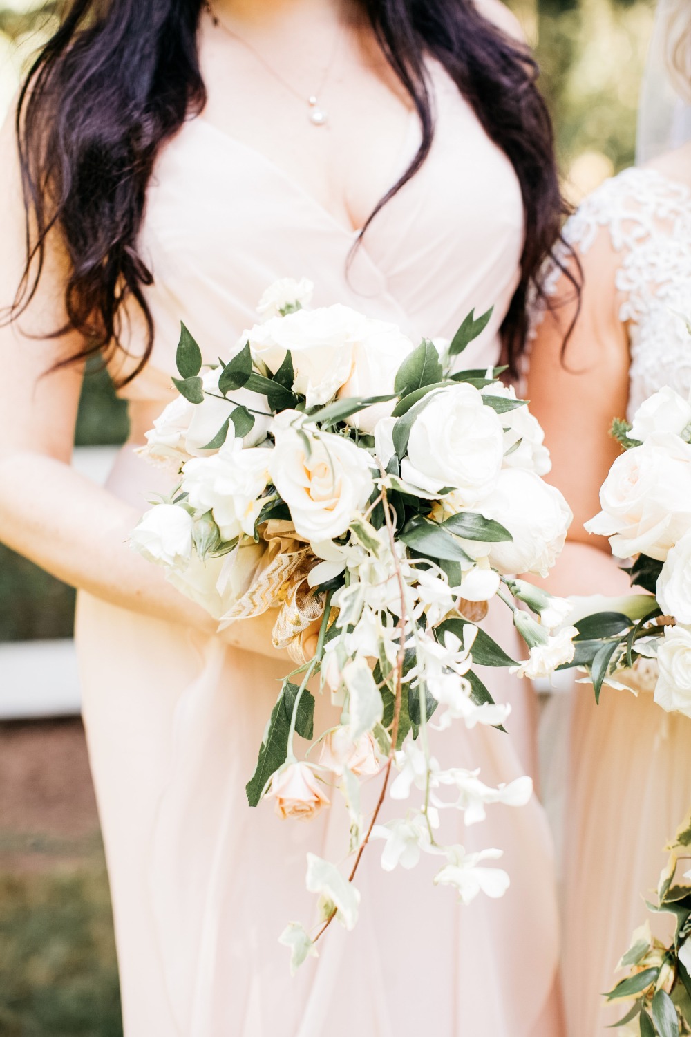 Blush dress and white bridesmaid bouquet
