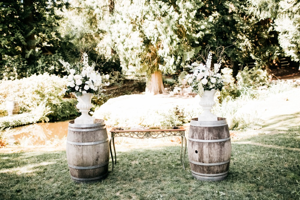 Whiskey barrel decor with large floral arrangements