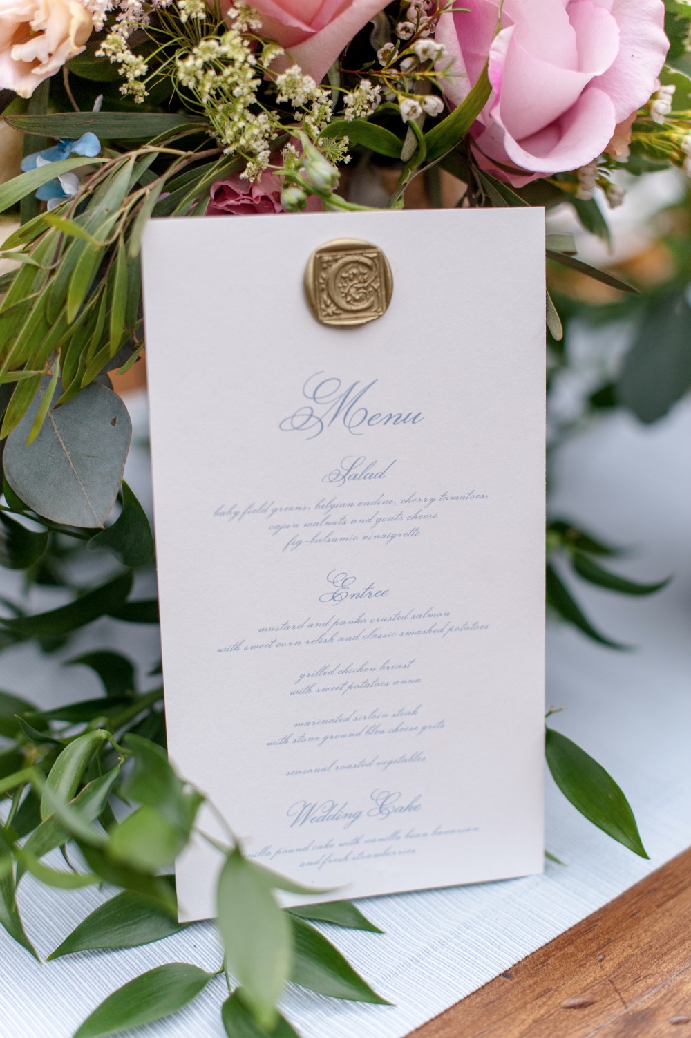 wax seal wedding menu in blue calligraphy