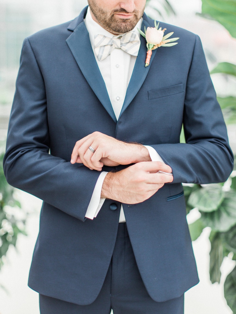 Navy suit with plaid bowtie