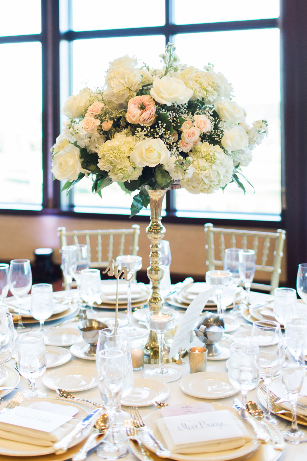 Elegant wedding table setting with floral centerpiece