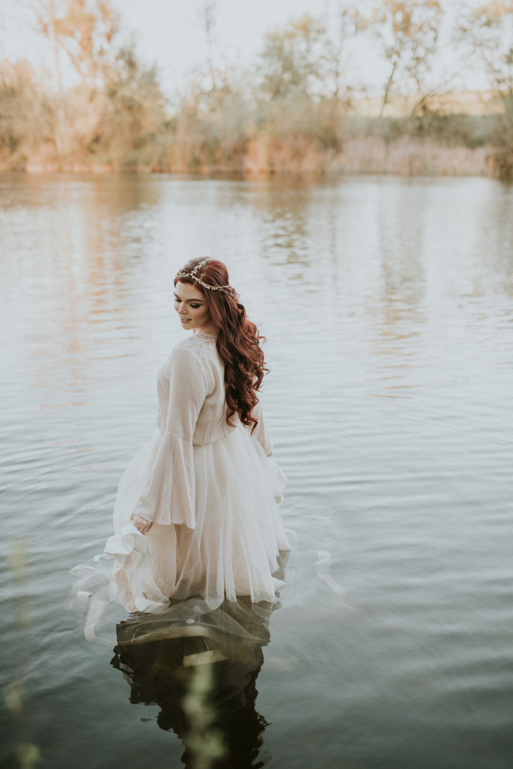 beautiful wedding dress photo in the river