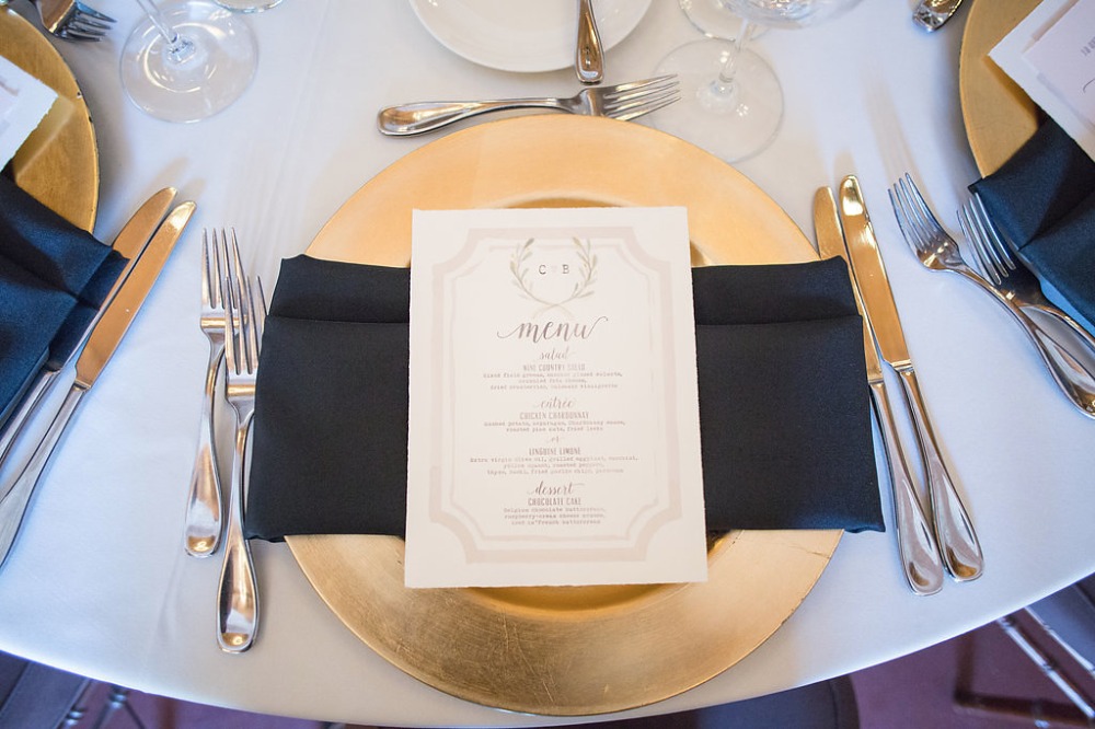 gold and navy place setting with romantic menu