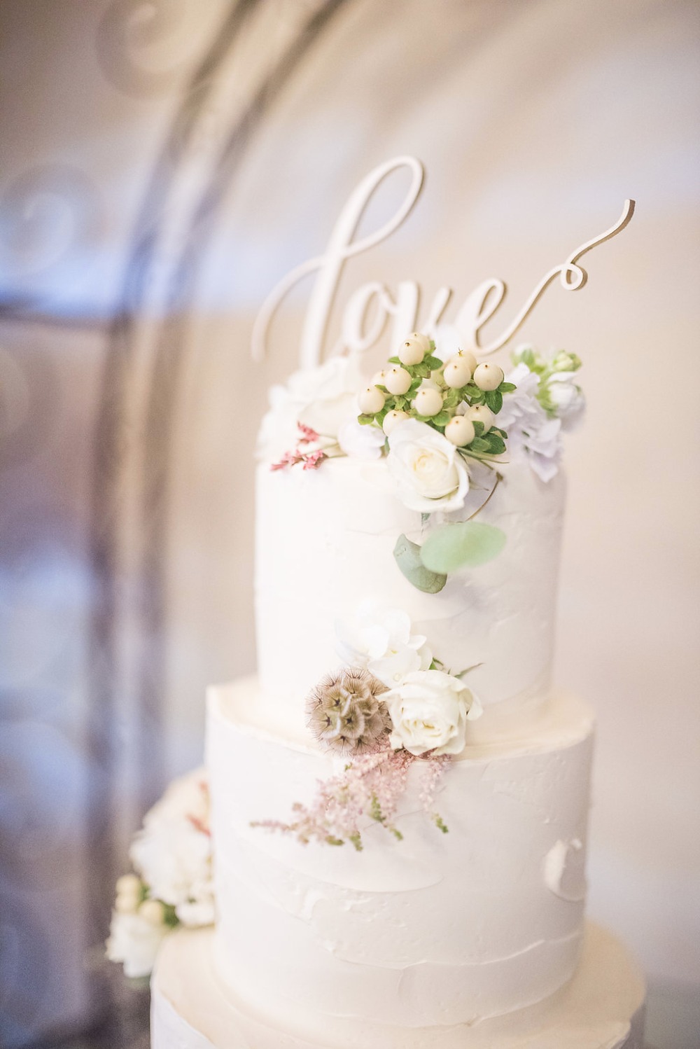love topped wedding cake