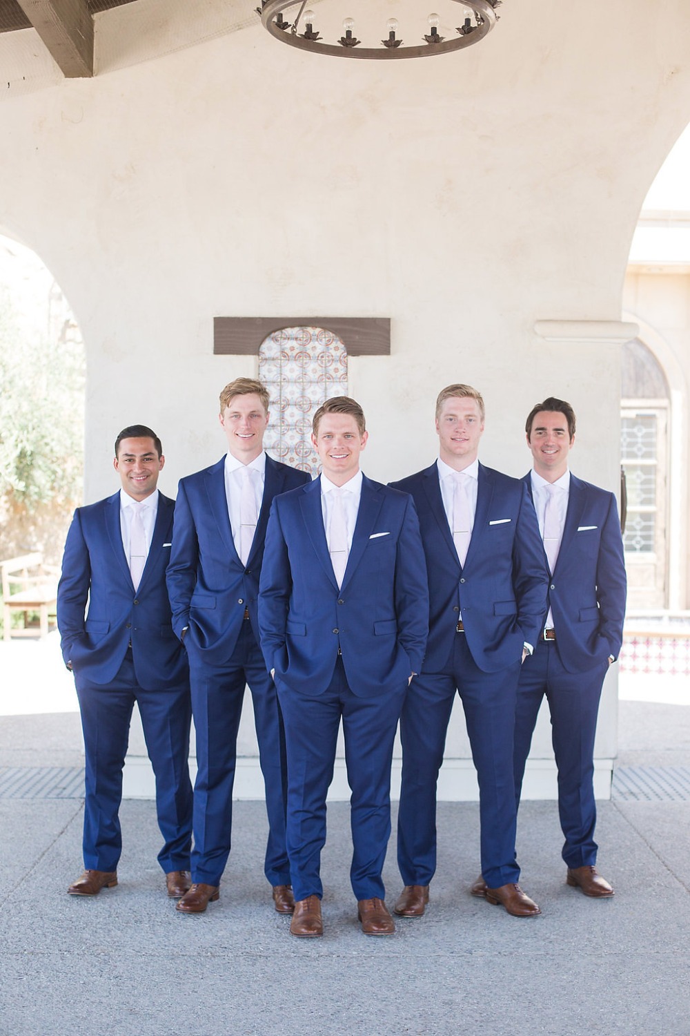 sharp looking groomsmen in matching navy suits
