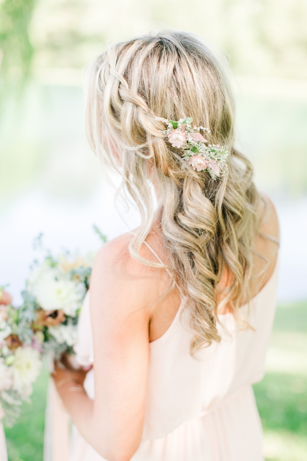 Floral accented bridesmaid hair