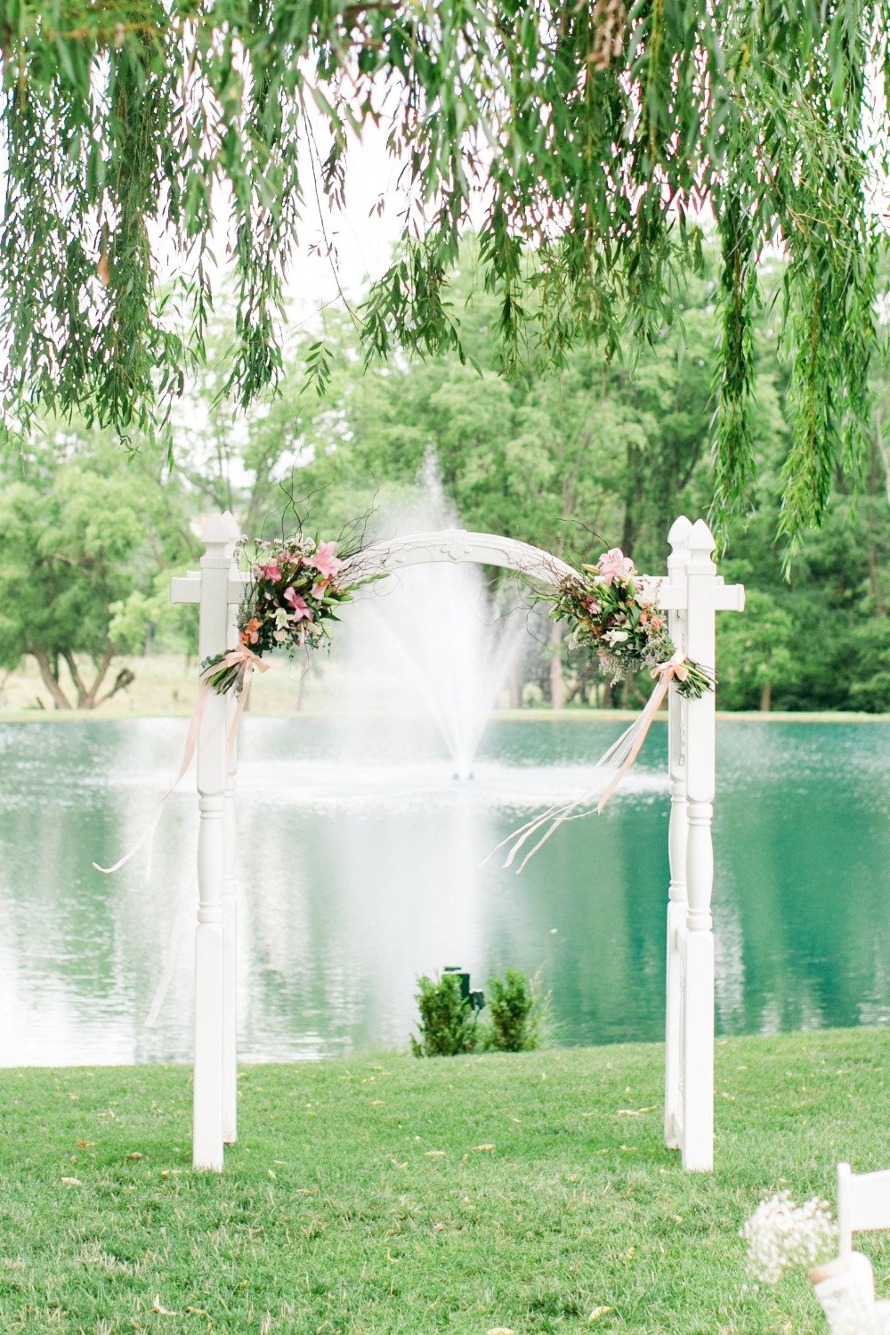 White wedding arch with florals