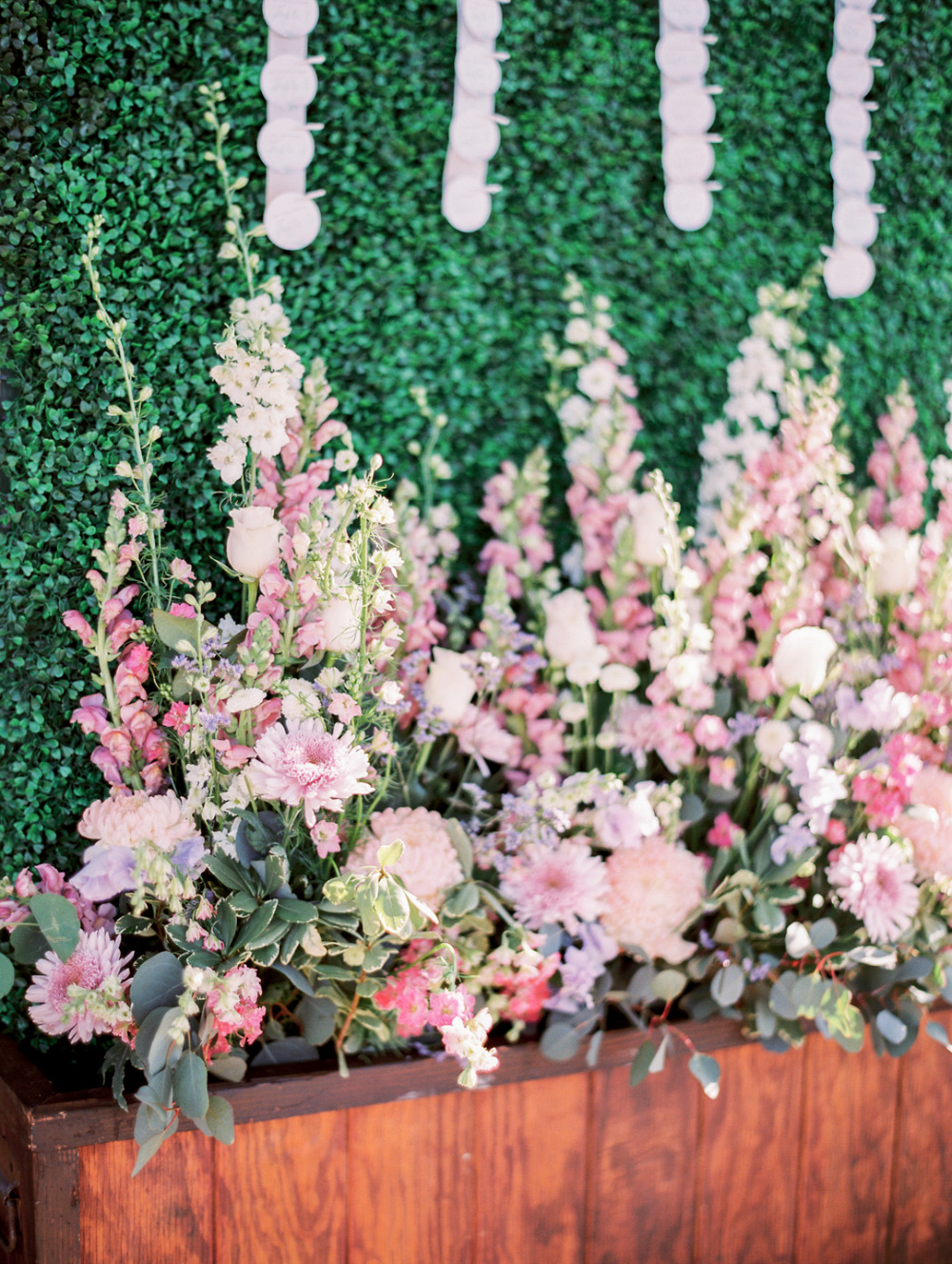 flower filled wedding decor escort cards display