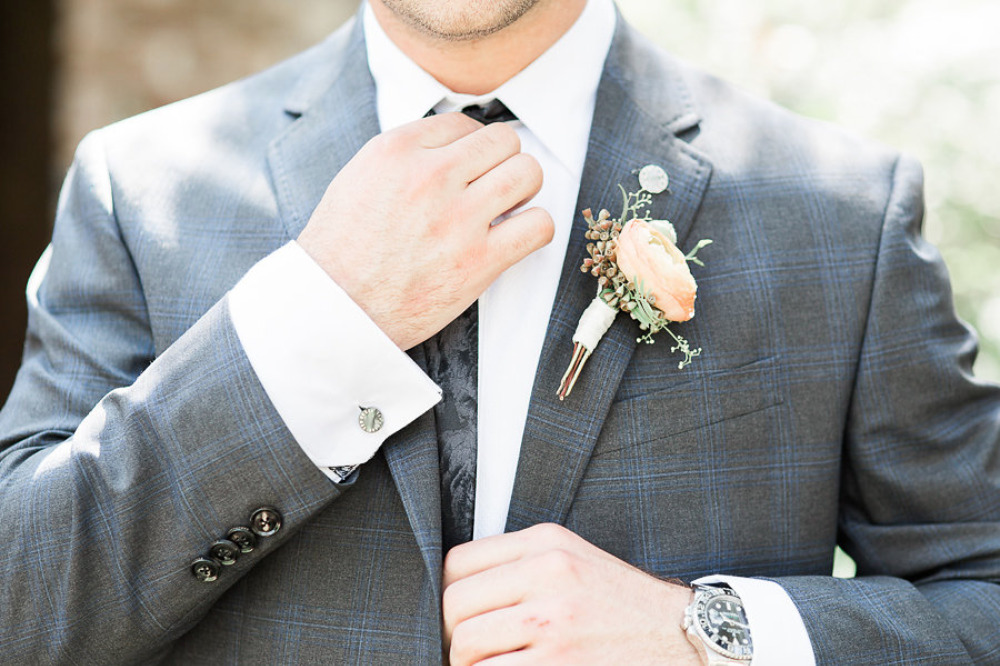 striped blue and grey grooms suit with ranunculus boutonniere