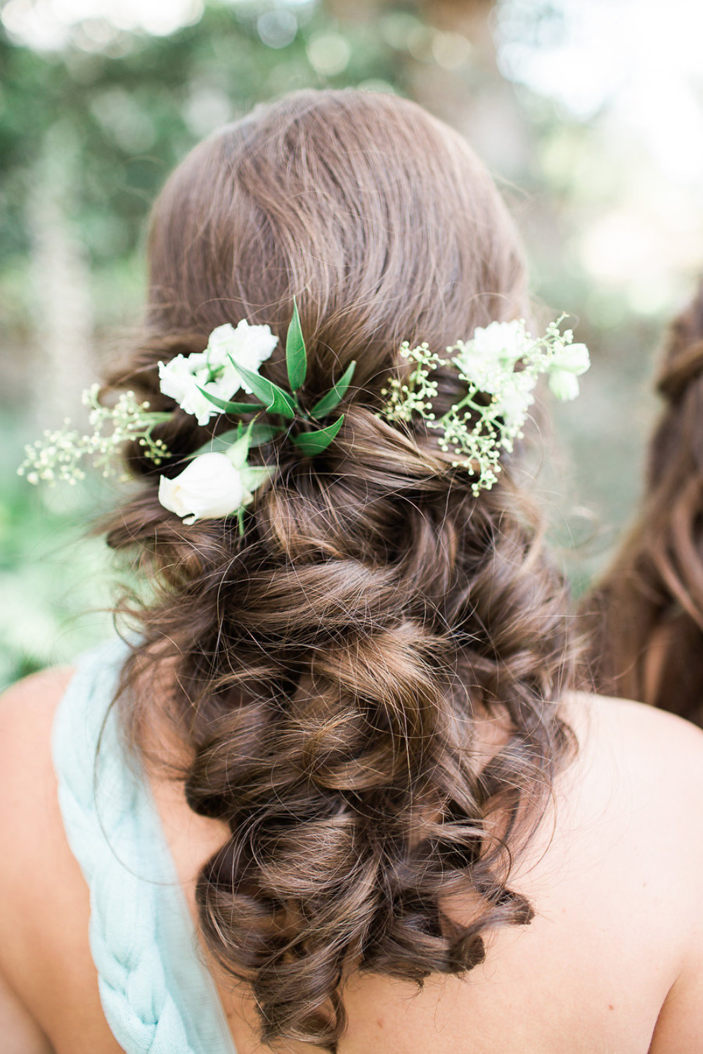 beautiful curled wedding bridesmaids hair with flowers