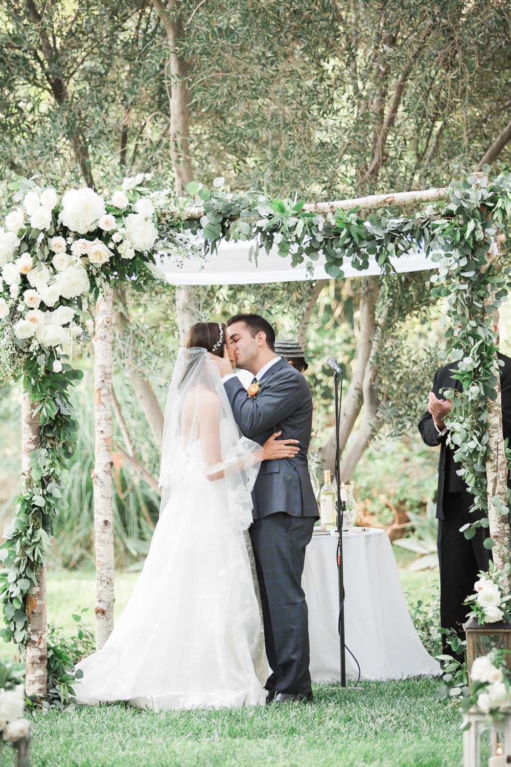 beautiful floral and birch wedding chuppah