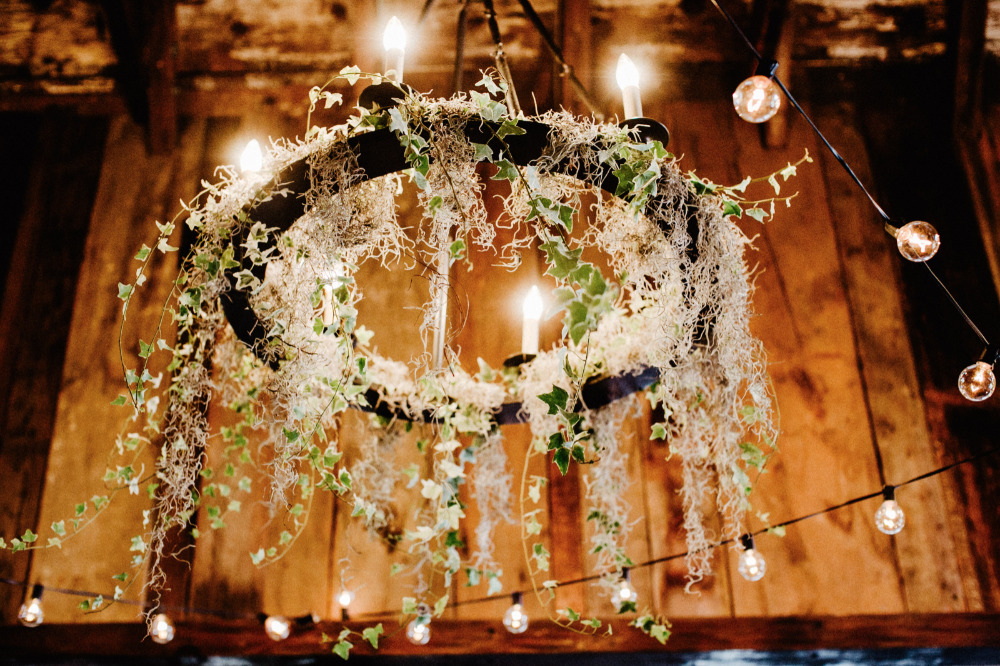 floral and candle chandelier wedding lighting