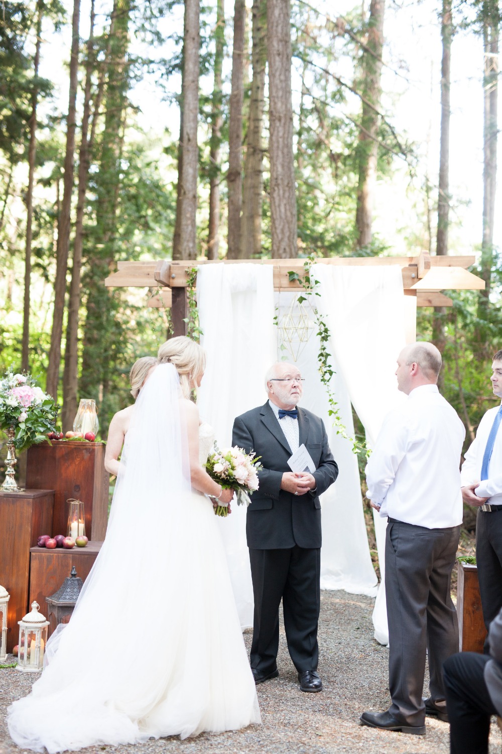 Bride and groom exchanging vows at outdoor wedding