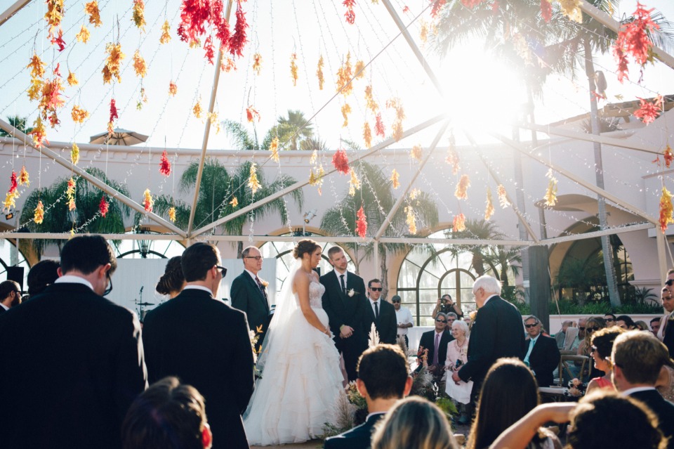 Wedding ceremony under a beautiful tent with flower decorations
