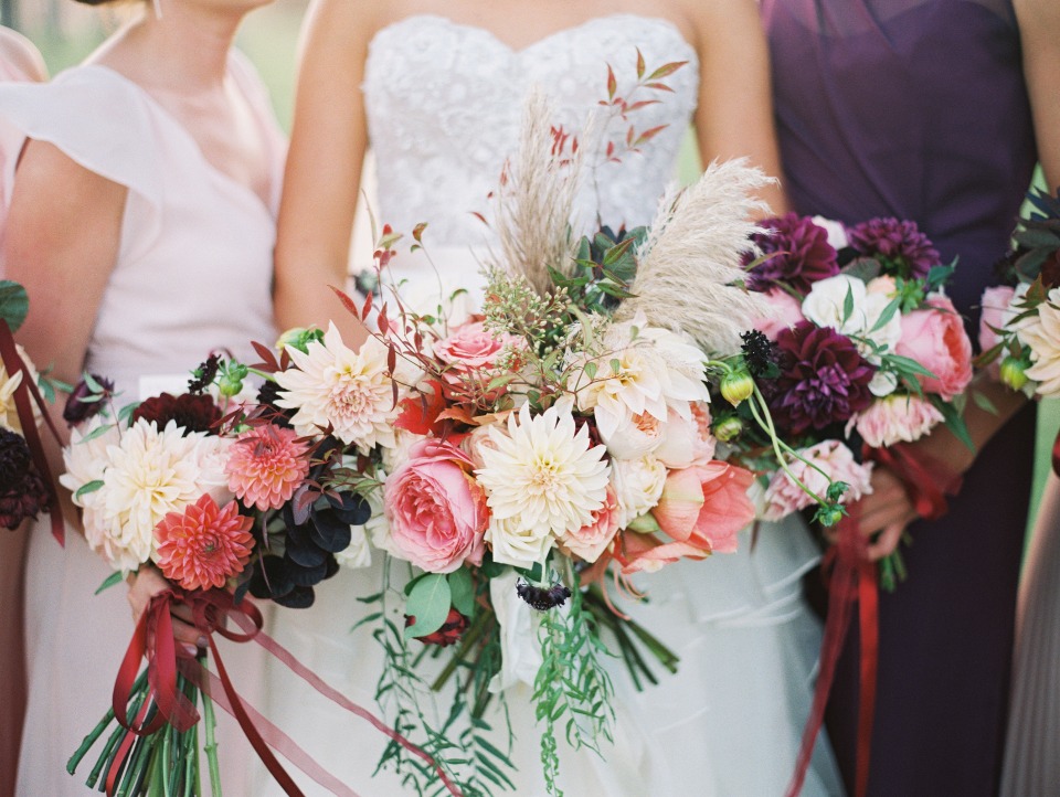 Stunning bridal bouquet with dahlias, roses, and pampas grass